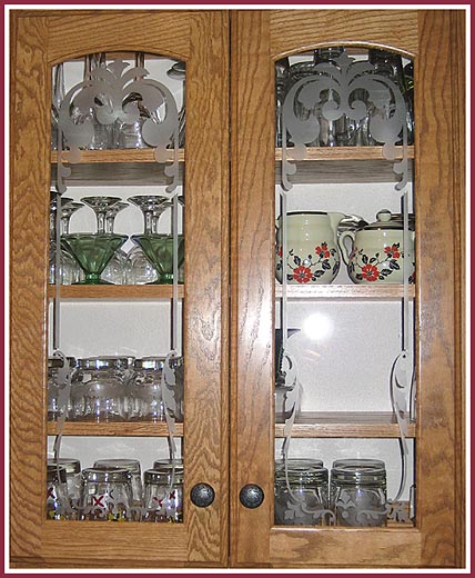 Beautiful etched cabinet doors add a unique touch to a kitchen remodeling.