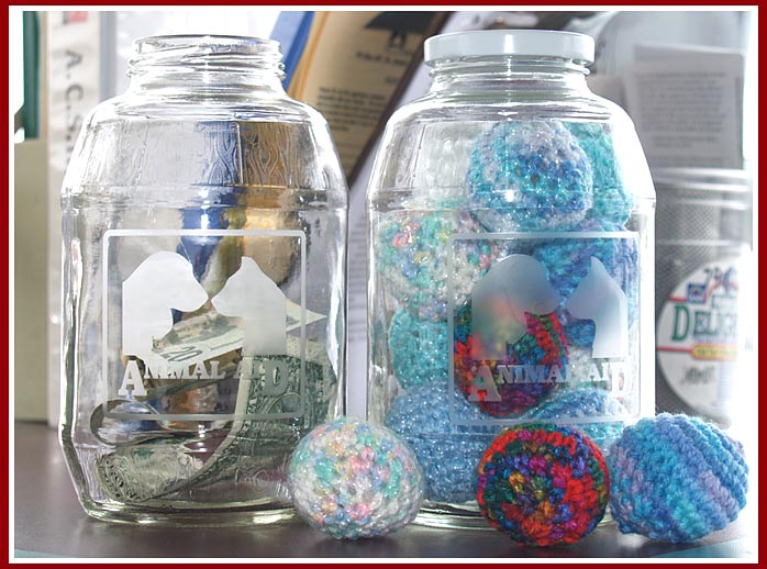 Animal Aid of SW MI uses unique donations jars from recycled applesauce jars and custom stencils from Egress Etch.