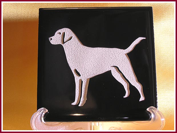 Decorative ceramic tile sand blasted with dog silhouette using Egress Etch stencils